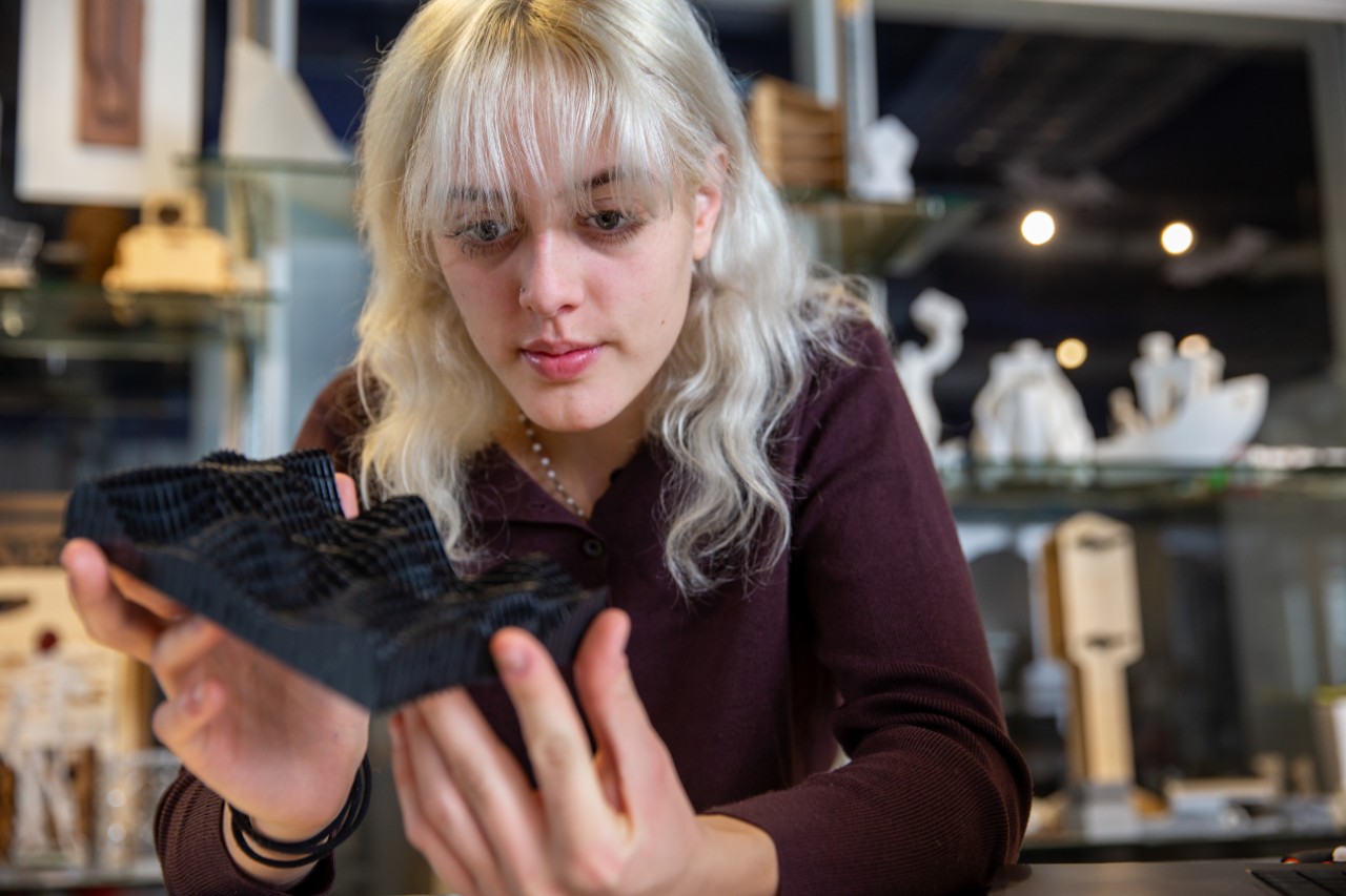 Students pose in DAAP for marketing photos. Kora Hammersmith