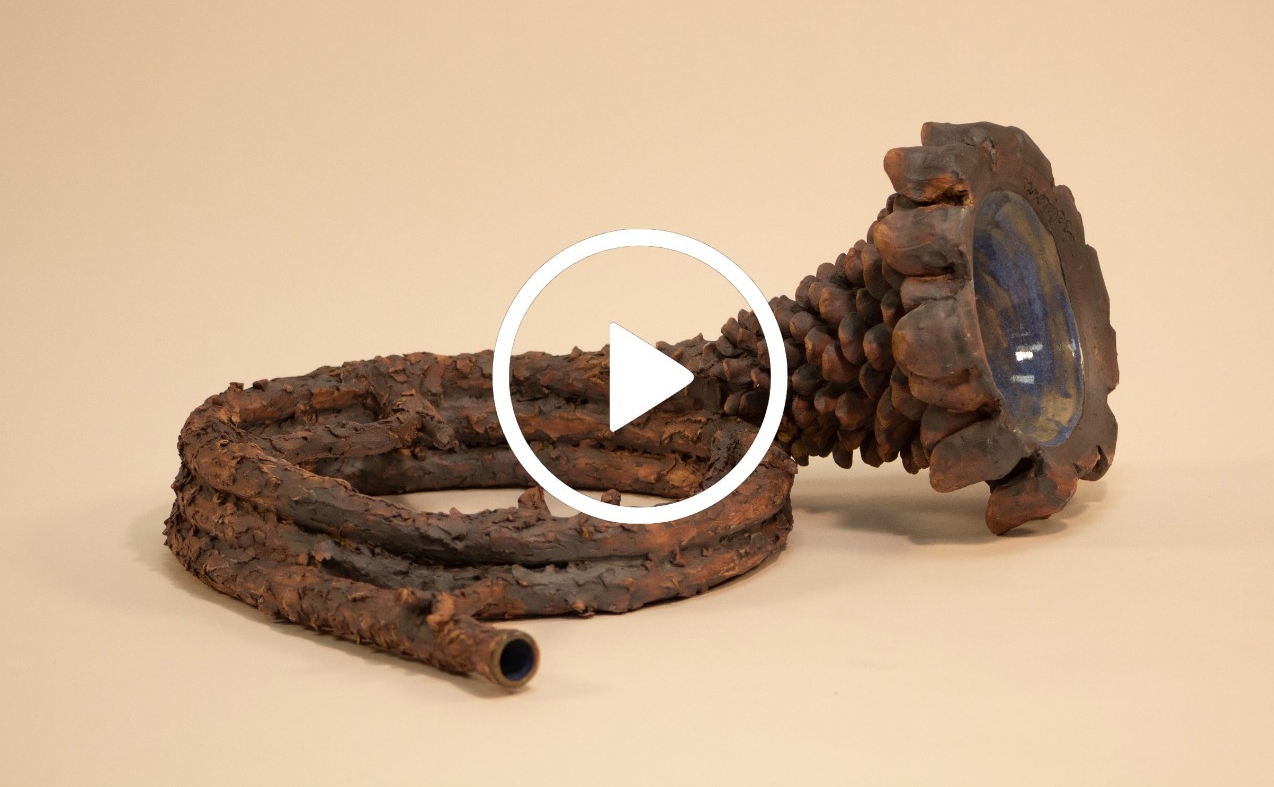 rustic floral designed trumpet with video icon overlayed